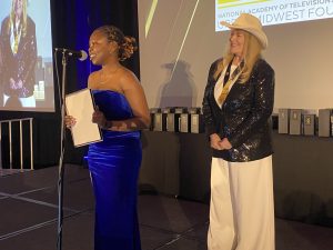 Lizzy Nioyke thanks Jodi for Carlini Scholarship